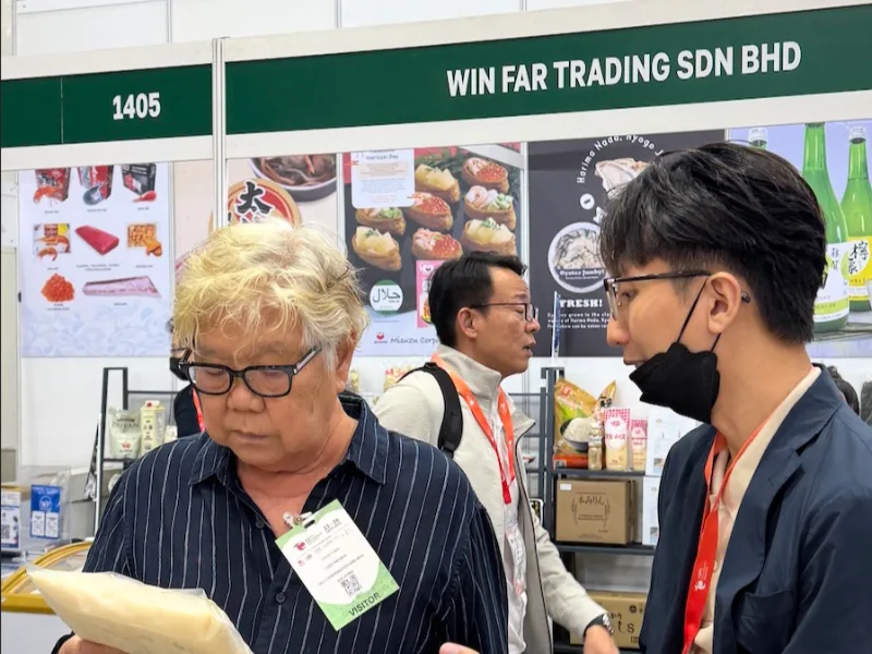A visitor looking at a pack from the Ippin range at the booth